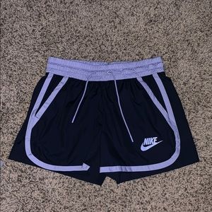 Dark navy blue and light purple swishy shorts.